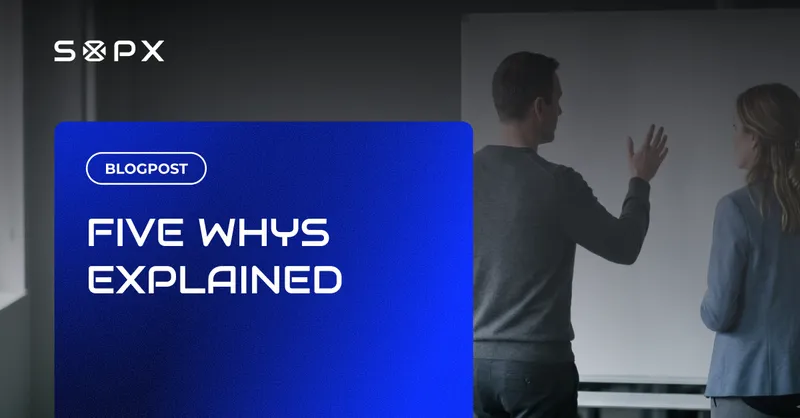 A man and woman analyzing a problem at a whiteboard using the five whys root cause method.